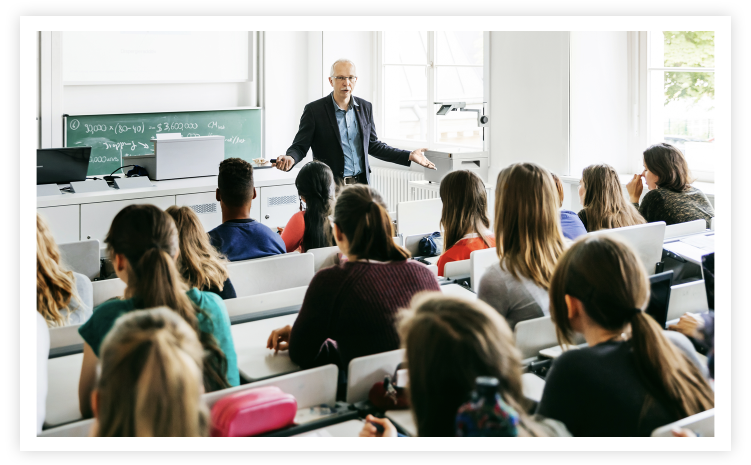 stock image of a teacher in front of a classroom of students